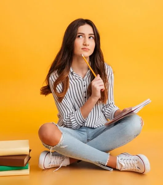 portrait pensive young girl-making notes